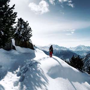 Man Backpacking in the Winter