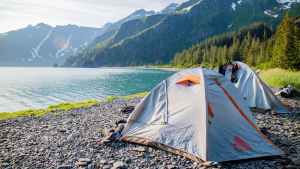 Tents by a rocky lake